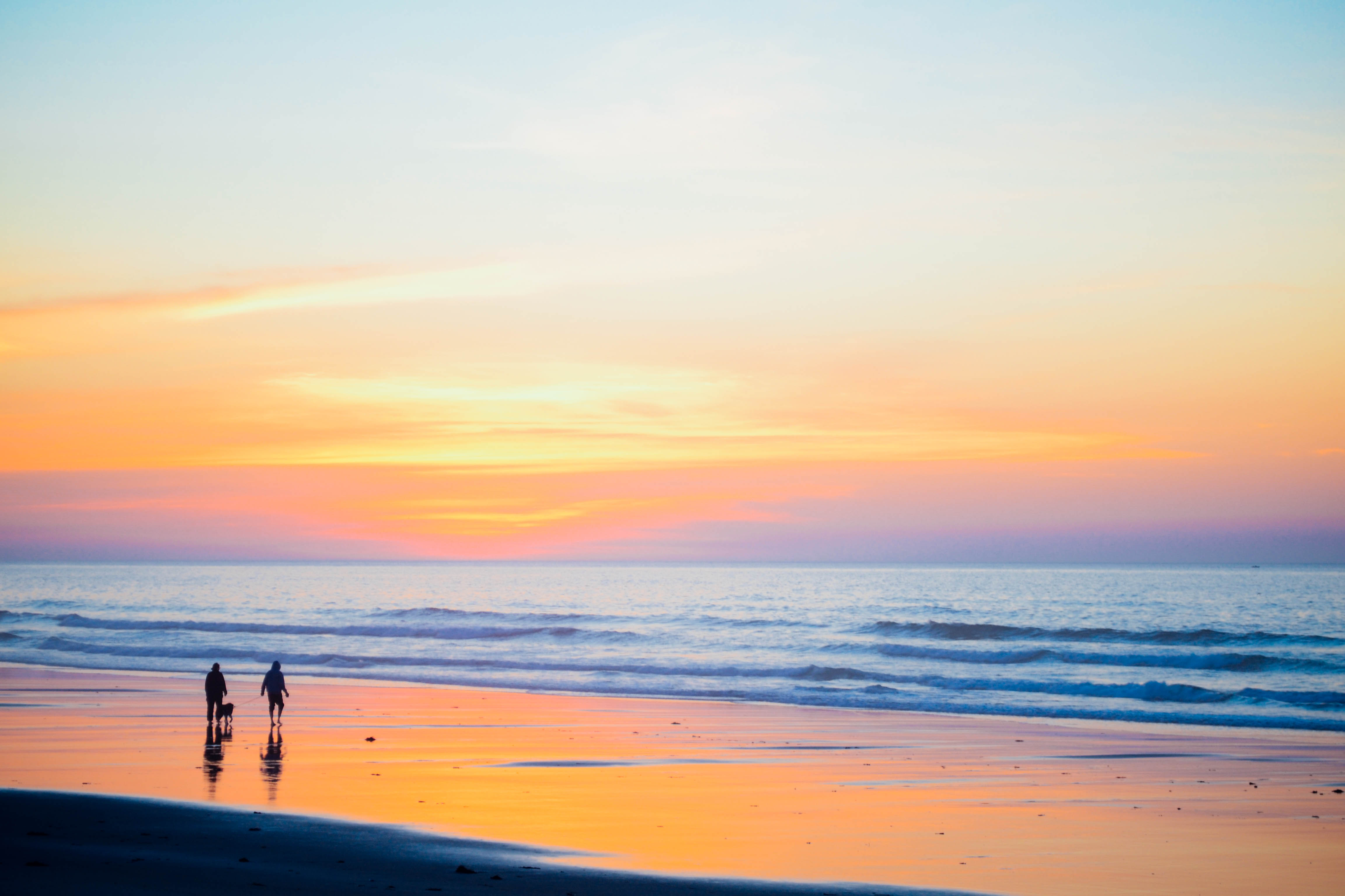 Family members together at sunset